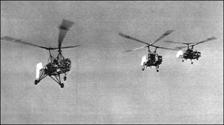 The original K-125 prototype Kaman helicopter (left) is here seen flying in company with two of the later, higher-powered K-190s