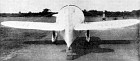 Rear view of the Gee Bee Model R-1, showing the completely circular cross-section of the fuselage forward and the extreme width of the rudder at the tail post