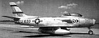 F-86A Sabre of the 71st Squadron, First Group. Note Group emblem aft of squadron emblem.